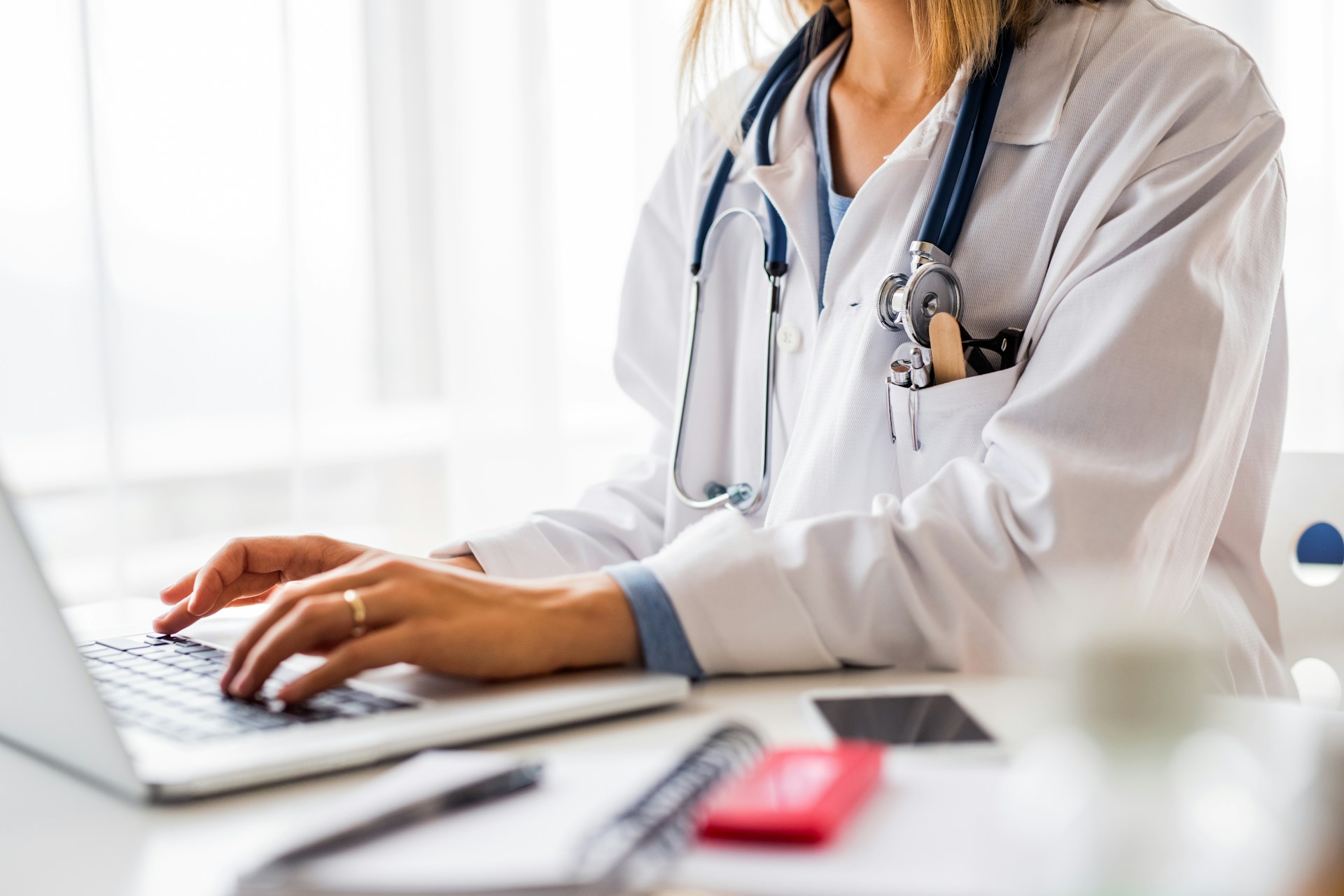 Doctor at a laptop typing